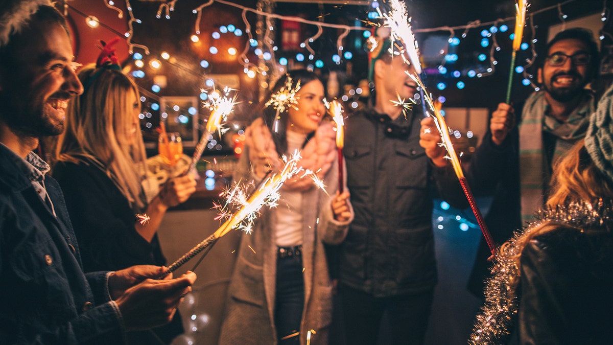 friends celebrating with sparklers