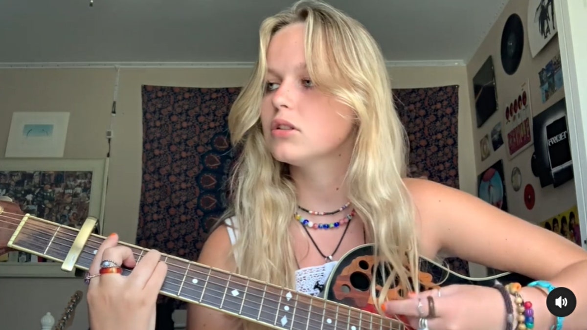 Jillian Ludwig playing the guitar
