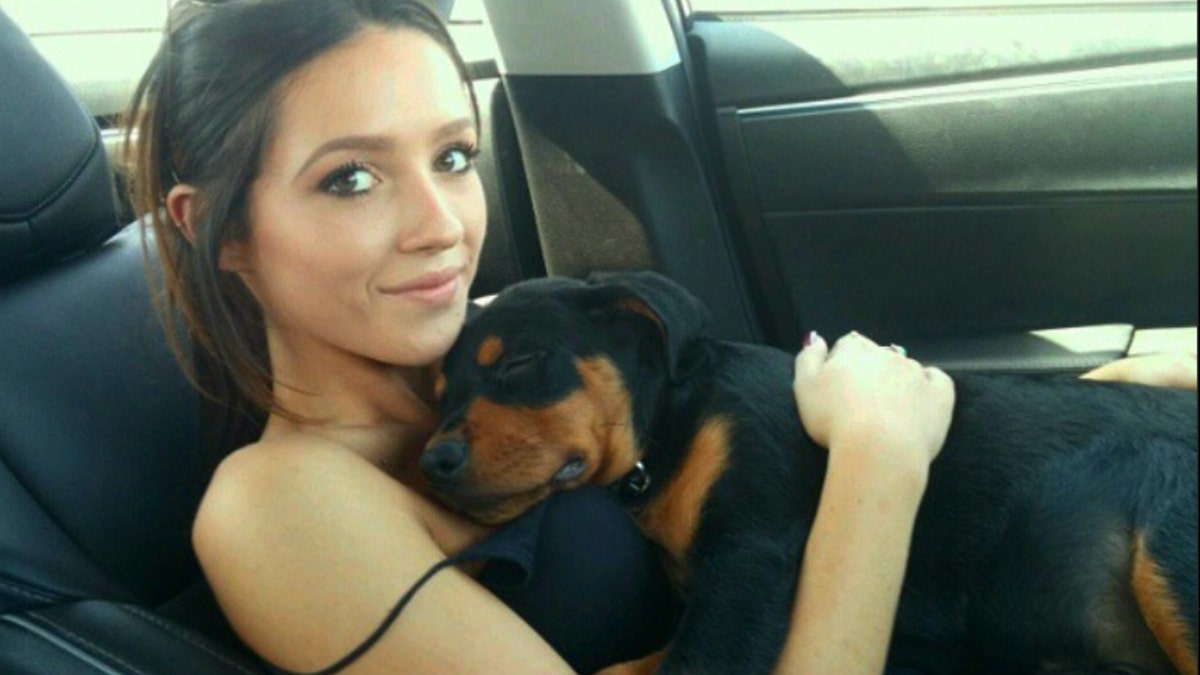 Tatum Goodwin holding her dog