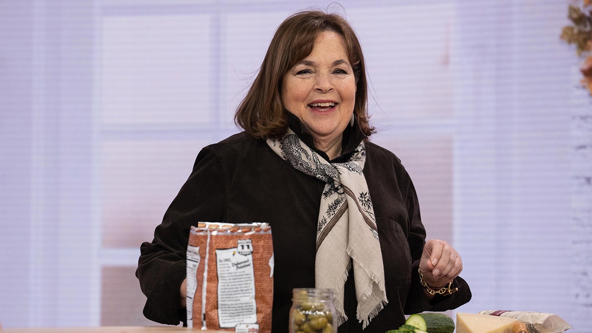 Ina Garten in a black sweater and scarf on the set of "Today"