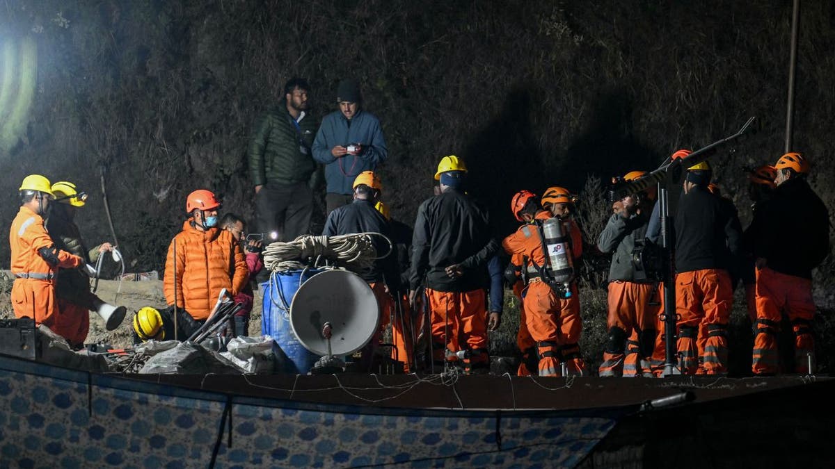 Rescue personnel in India prepare to enter into a tunnel where 41 workers are trapped