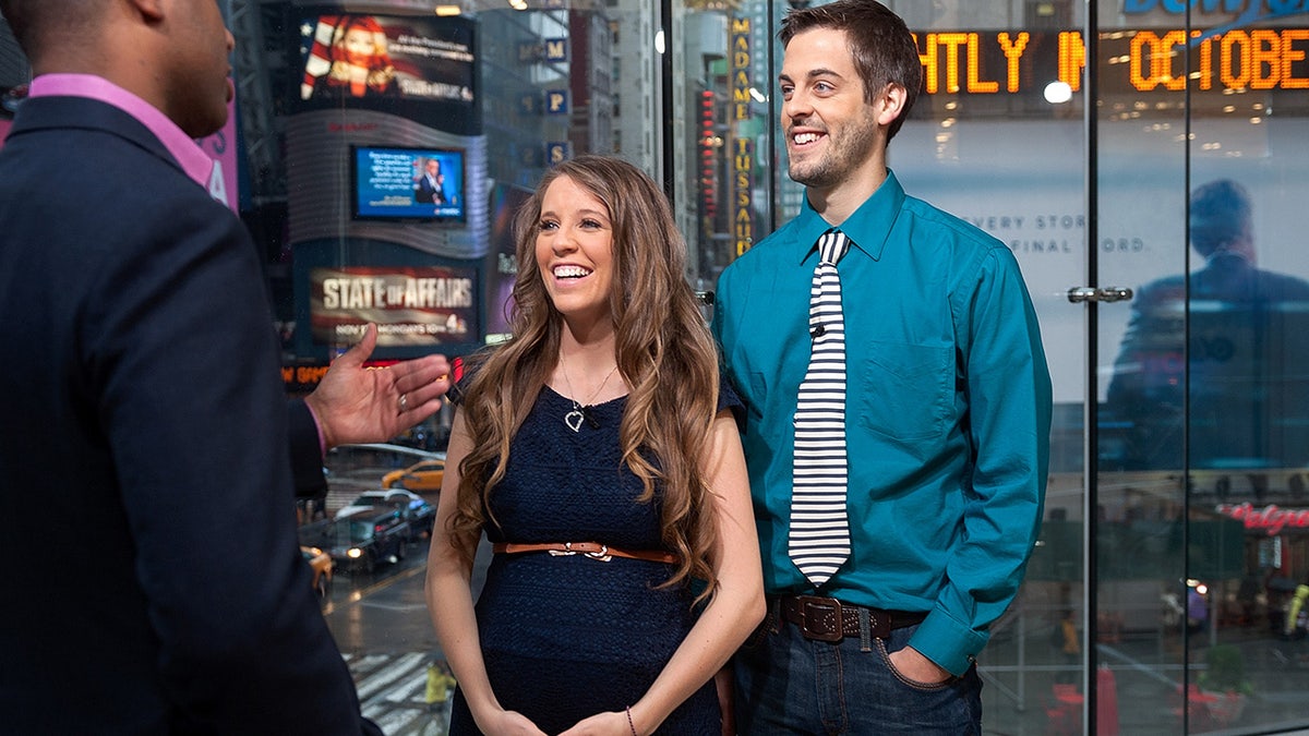 A pregnant Jill Duggar with husband Derick Dillard