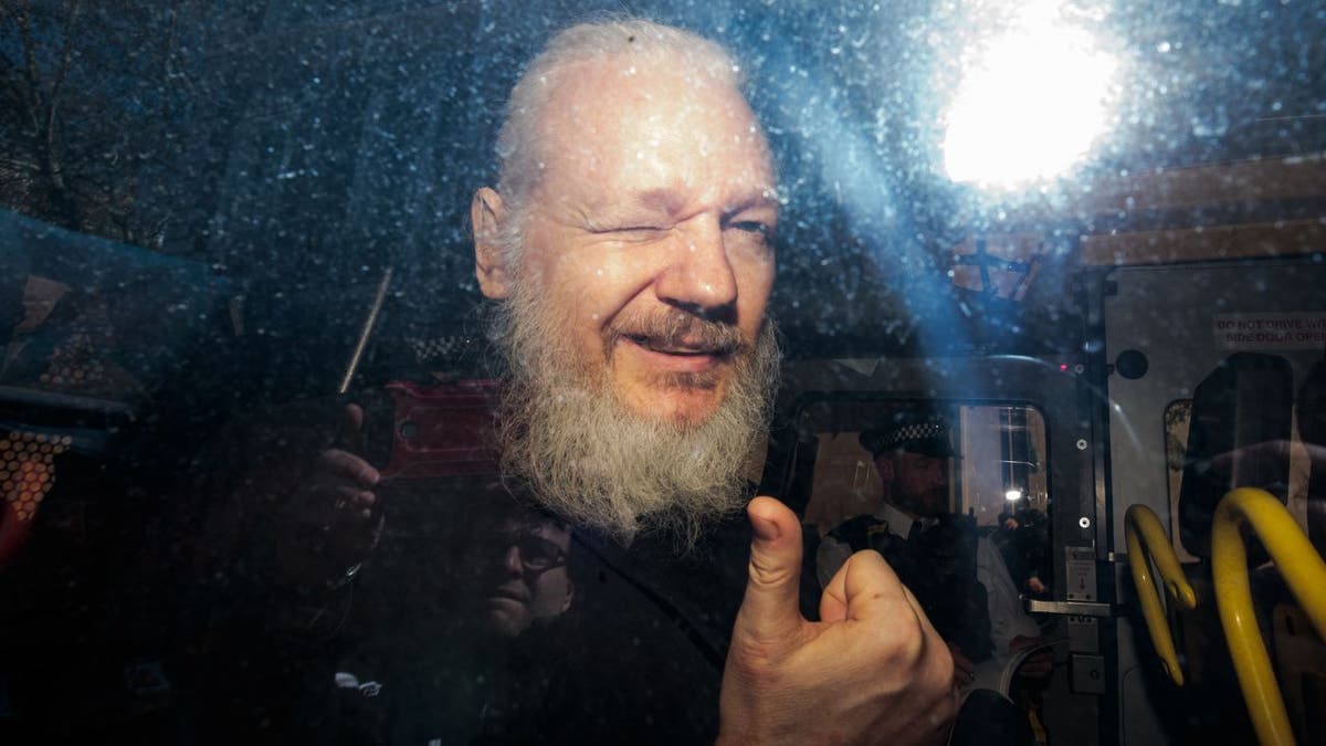 WikiLeaks founder Julian Assange gives a thumbs up