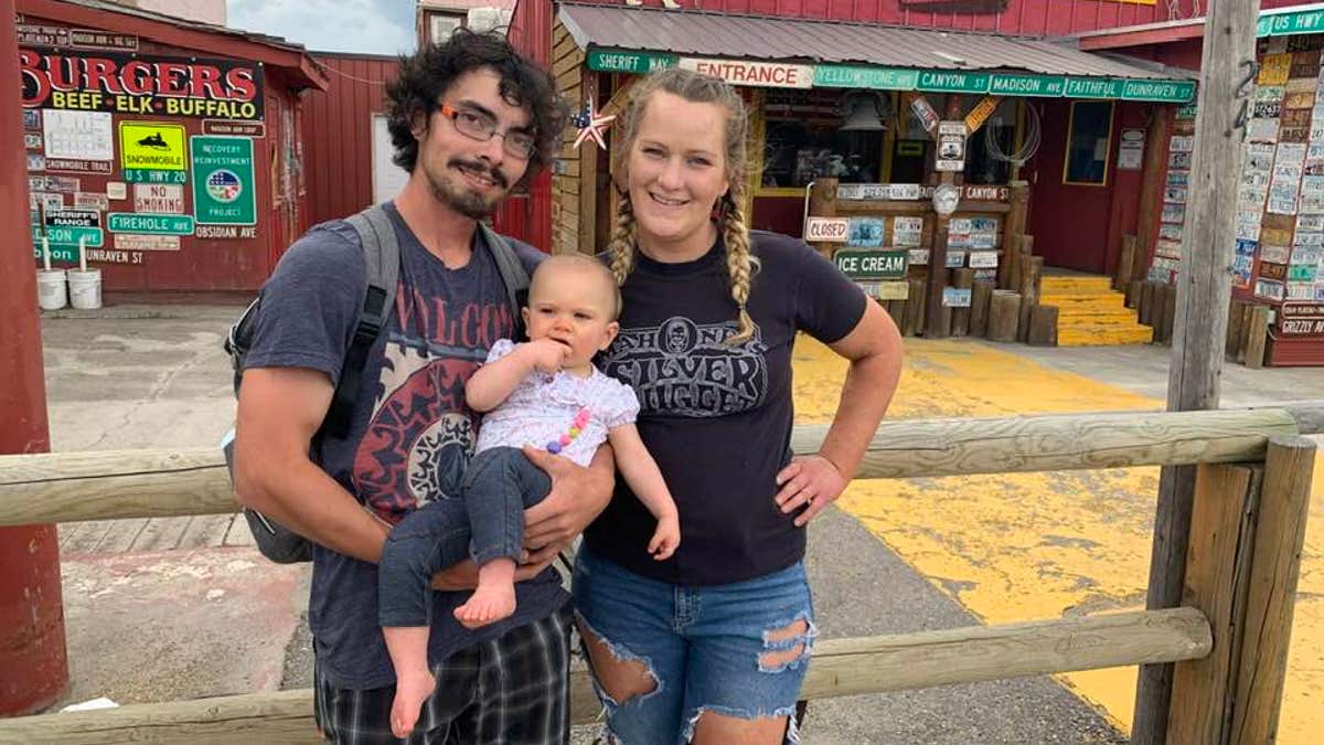 Katie Ferguson pictured with her ex-boyfriend and her daughter