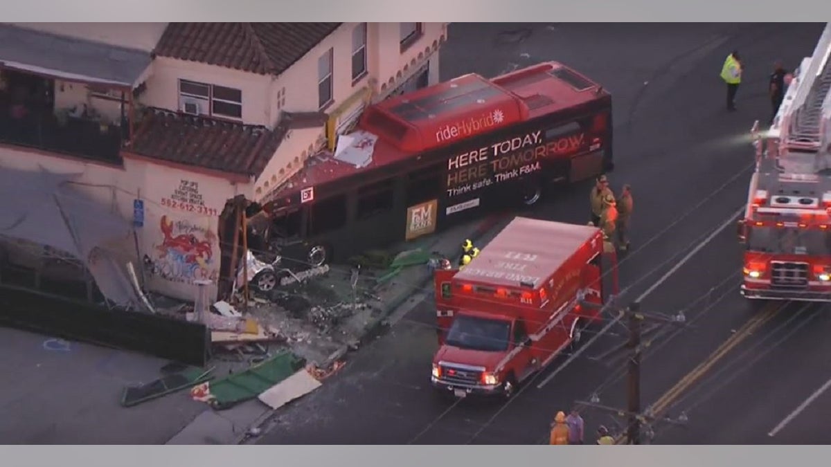 A bus seen partially inside a seafood restaurant after a crash