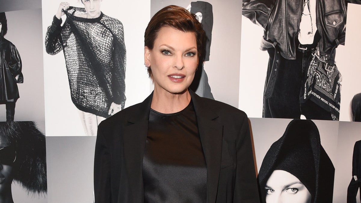 Linda Evangelista smiling on red carpet