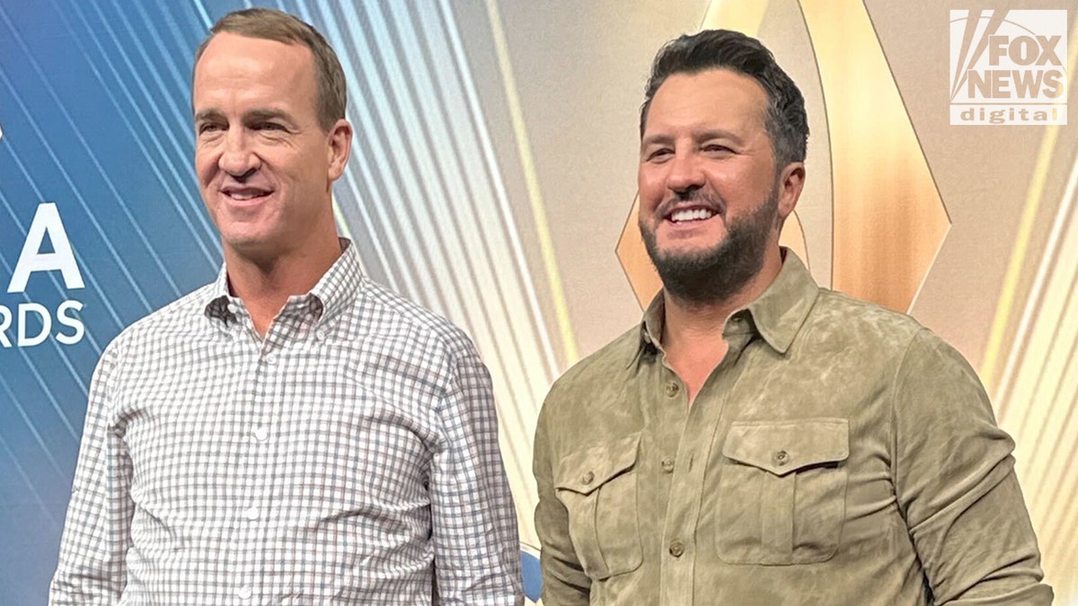 Luke Bryan and Peyton Manning at the CMA press conference