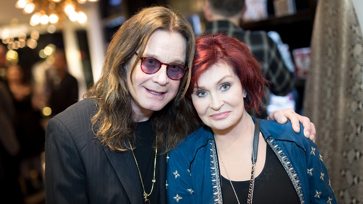 Ozzy Osbourne hugging wife Sharon