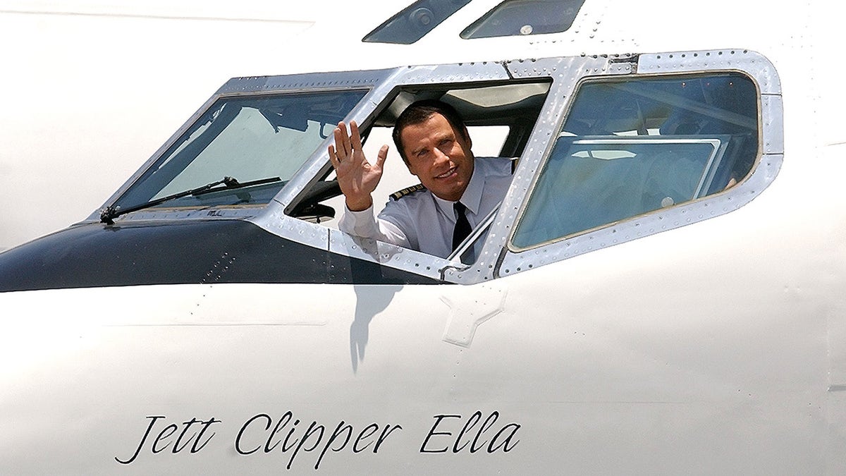 John Travolta flies his plane
