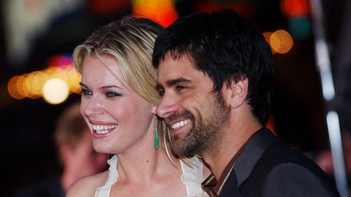 John Stamos with Rebecca Romijn