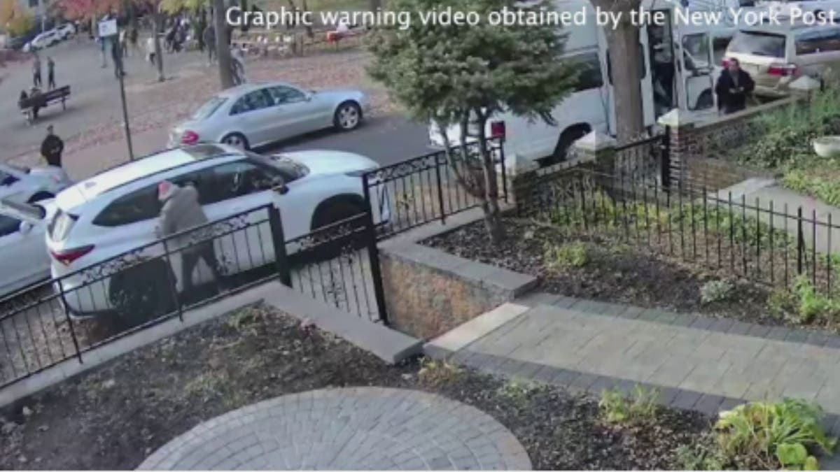 a screenshot of the suspect breaking into the victim's car