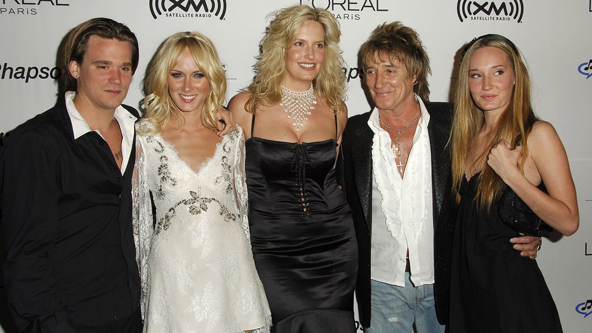 Rod Stewart walks red carpet with wife Penny Lancaster and children