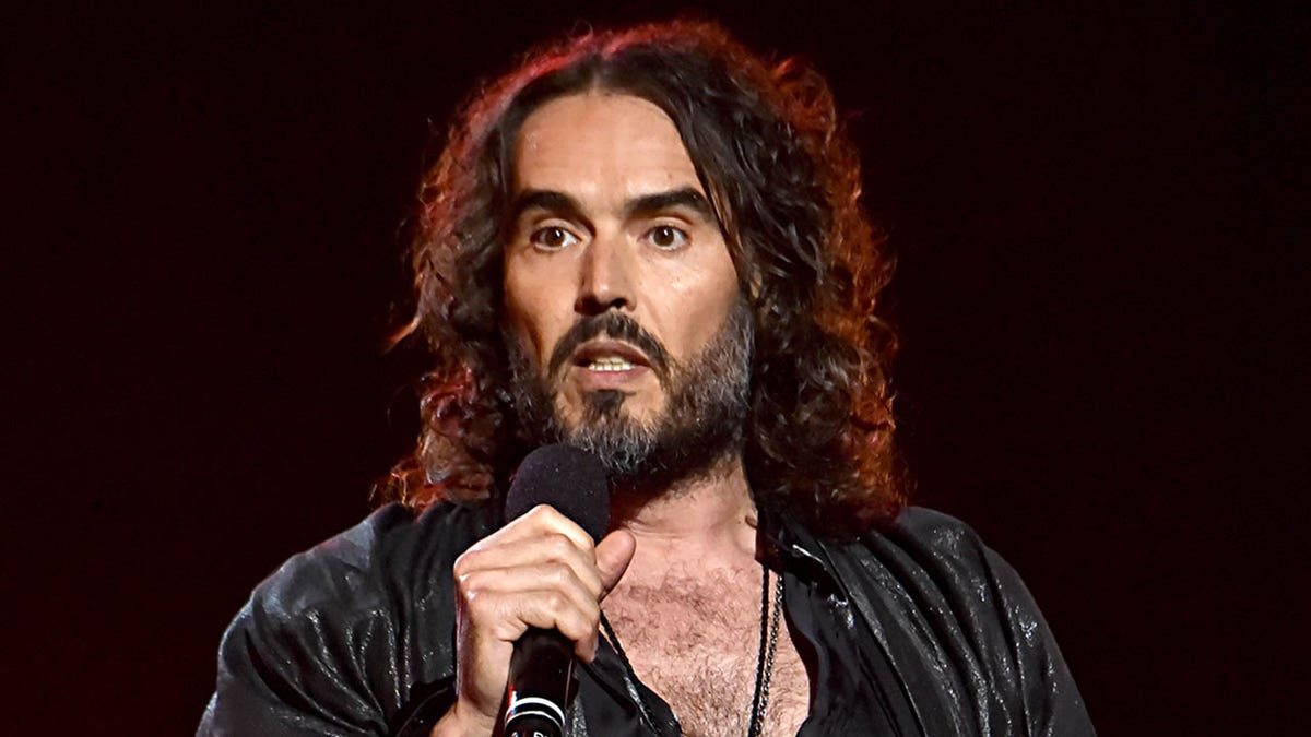 russell brand holding mic