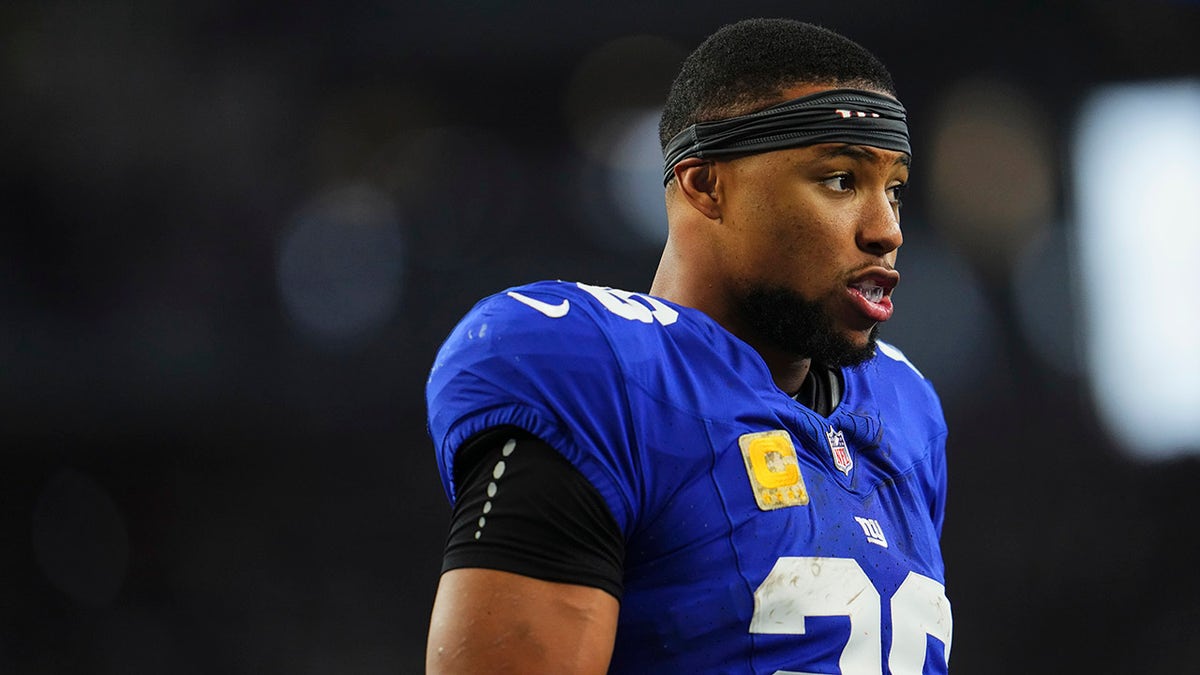 Saquon Barkley looks on during a game against the Cowboys