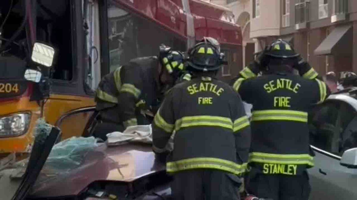 firefighters extricating sedan driver