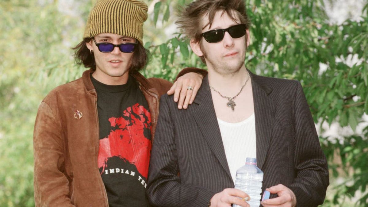 Johnny Depp and Shane MacGowan standing together in 1994
