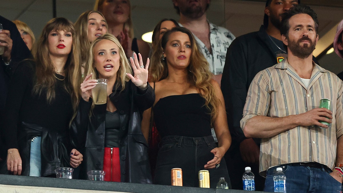 Taylor Swift, Brittany Mahomes with her hand outstretched, Blake Lively and Ryan Reynolds watch the Kansas City Chiefs play the New York Jets