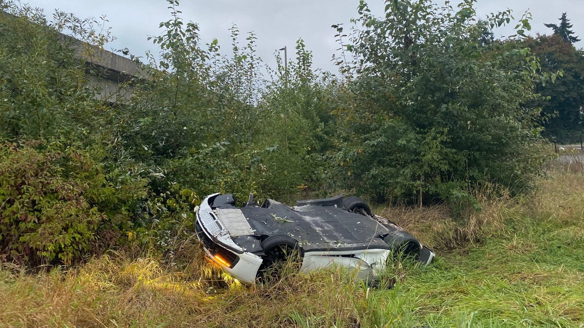 Ting ye's car upside down in a ditch after the crash