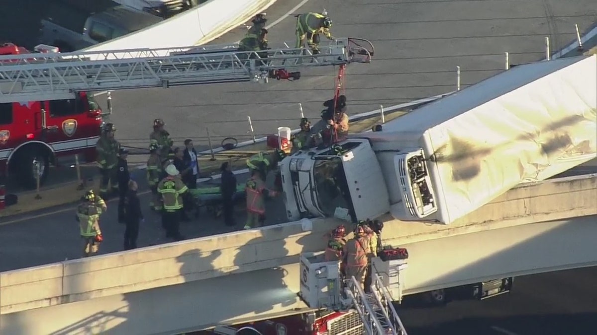 Truck hangs over Houston highway