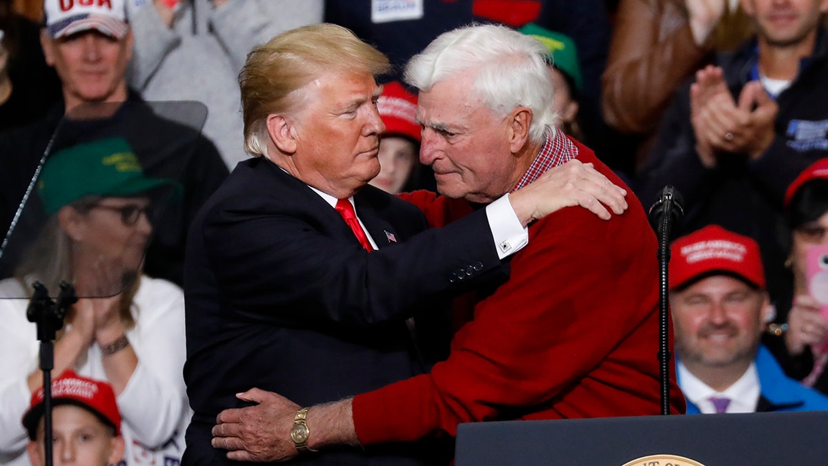 Trump and Bob Knight hugging