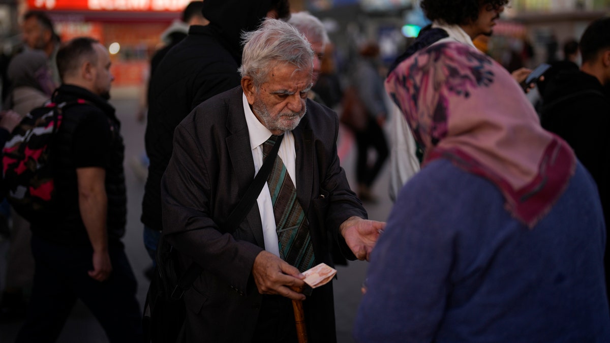 Man purchases from Turkish street vendor
