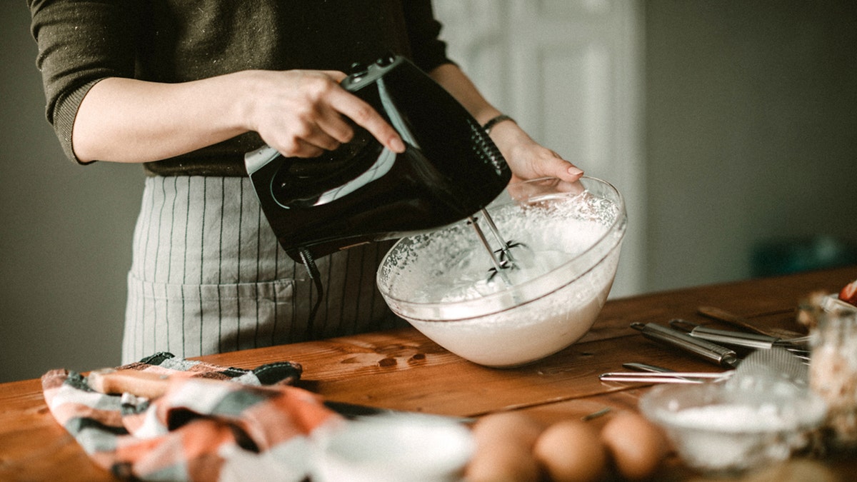 woman whisking whipped cream