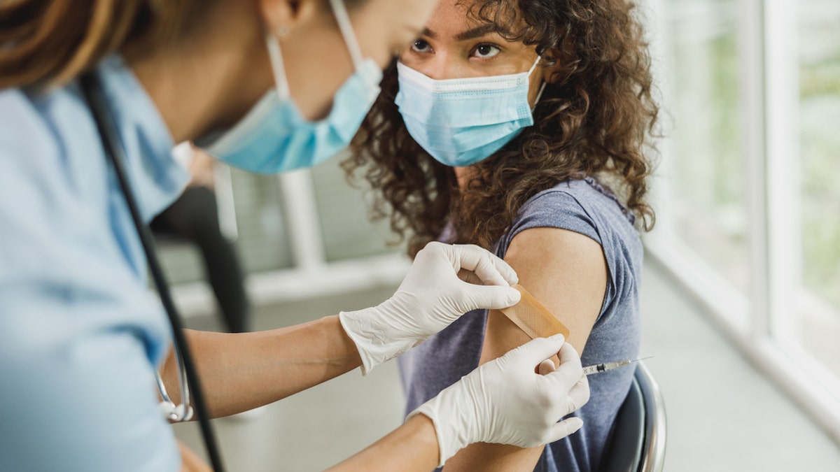 Woman getting vaccine