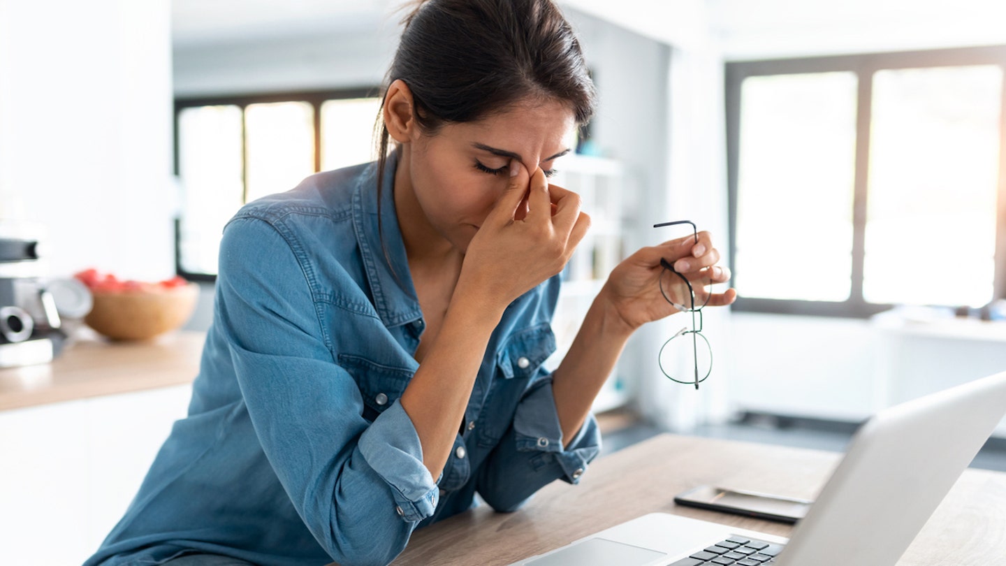 tired woman at computer