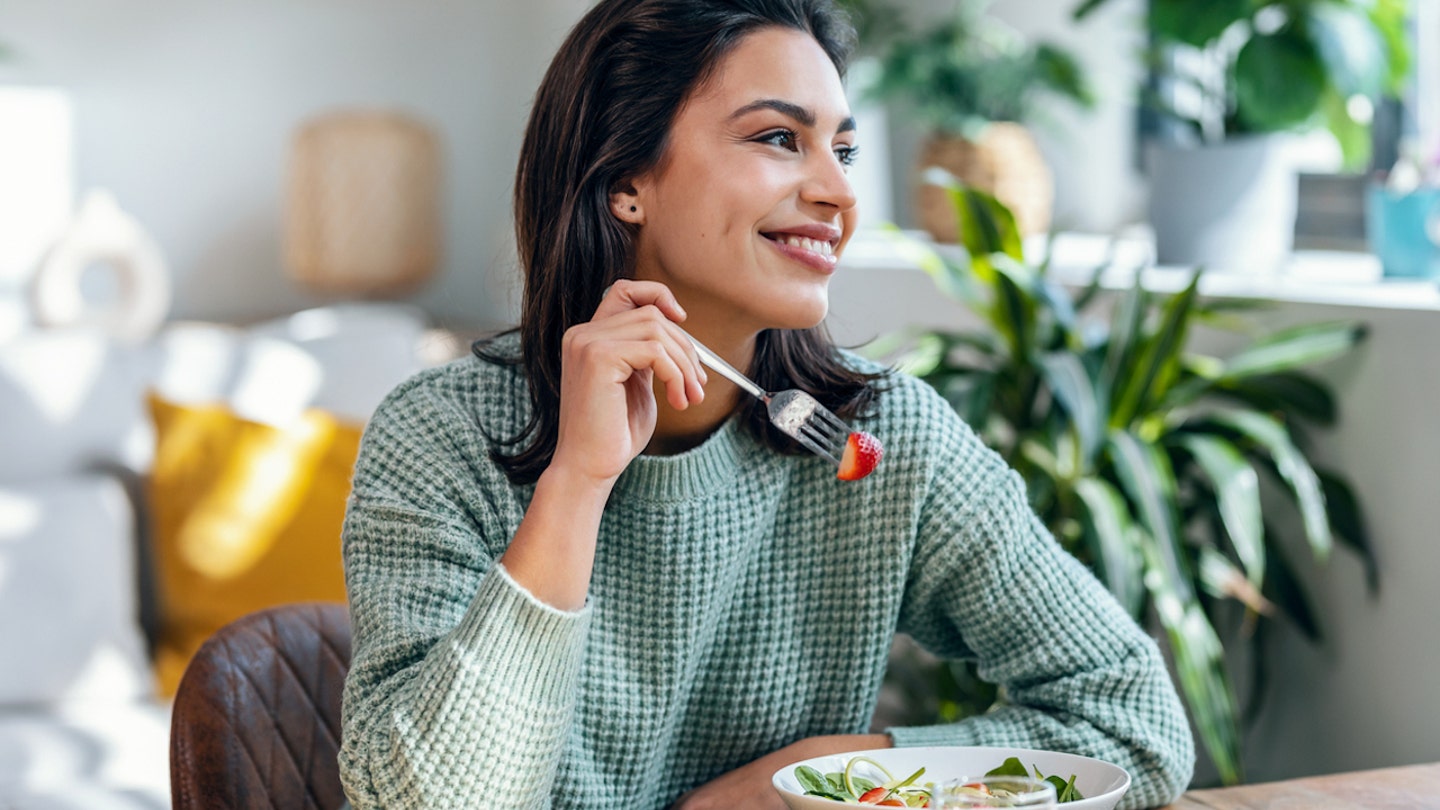 woman eating strawberries