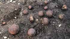 Massachusetts fire officials investigating chance discovery of cannonballs during trench dig
