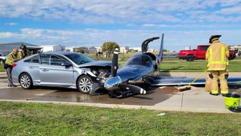 Texas plane crashes into car after overshooting runway