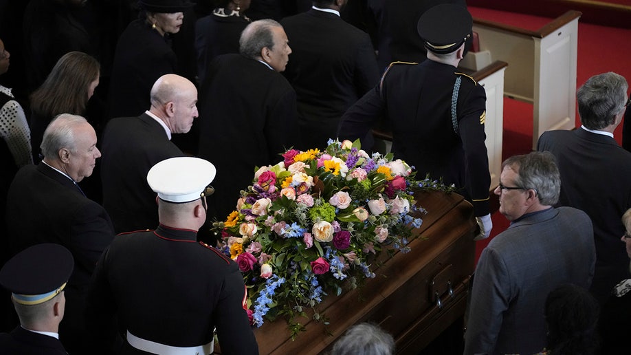 Rosalynn Carter coffin makes it way down church aisle