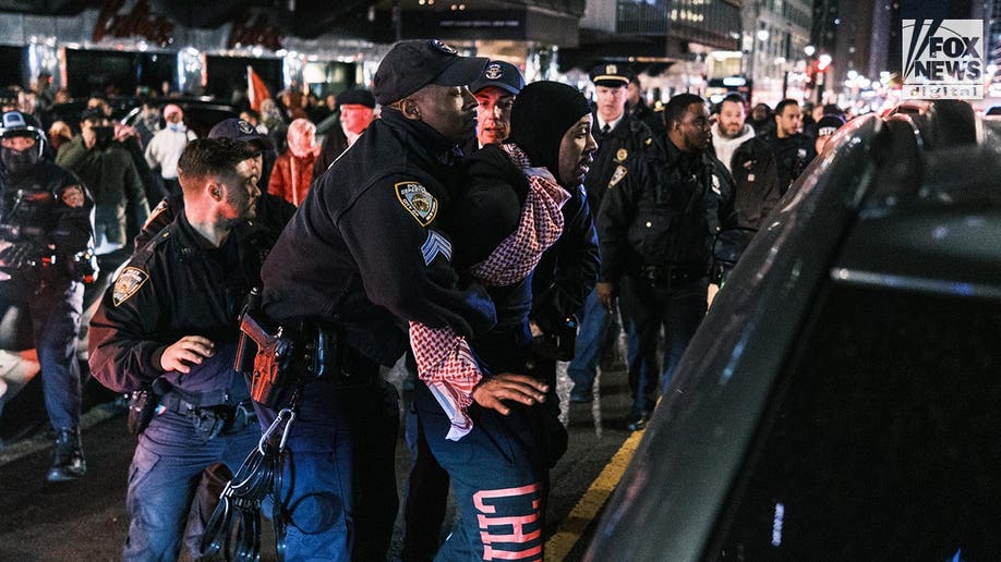 A protester is detained by NYPD