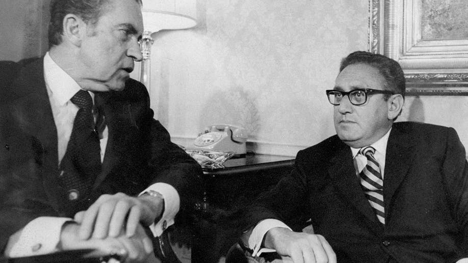 Richard Nixon and Henry Kissinger are photographed.