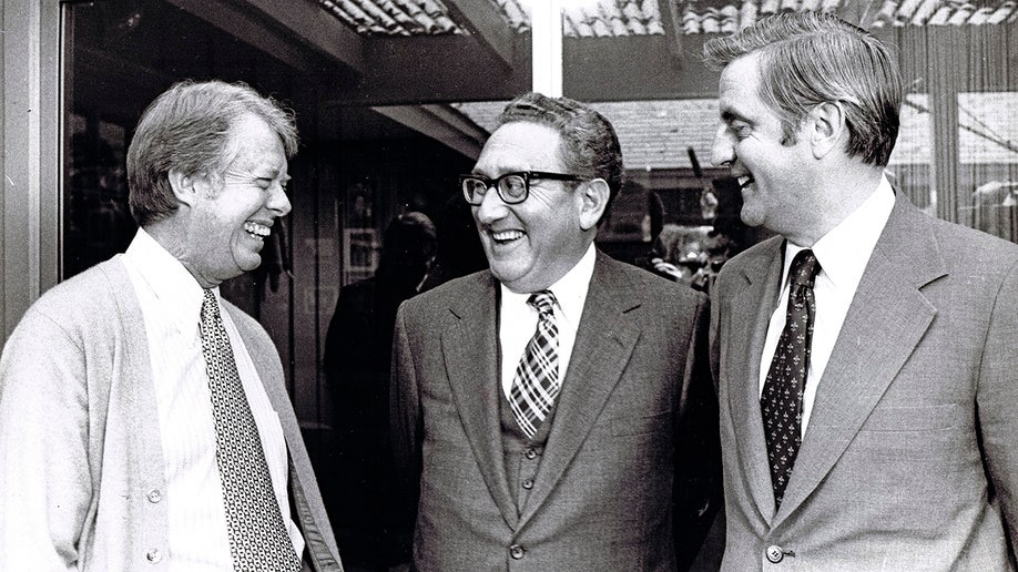 Jimmy Carter, Henry Kissinger, and Walter Mondale as they meet for a foreign policy briefing