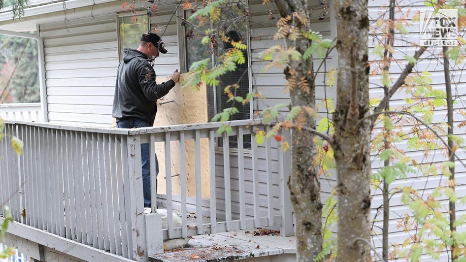 Investigators at the home of the slain University of Idaho students