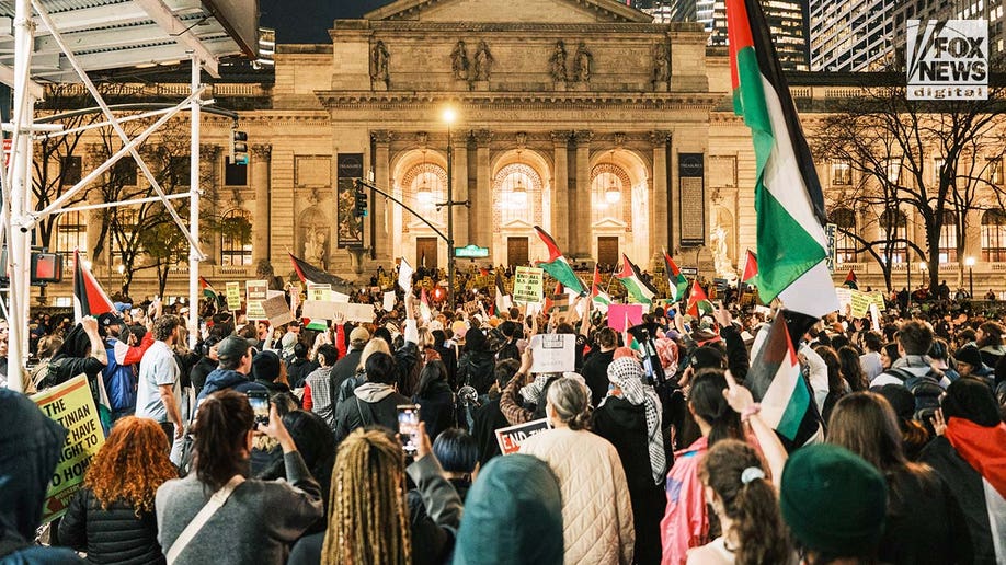 Pro-Palestine protesters gather outside of the New York Public Library in midtown Manhattan