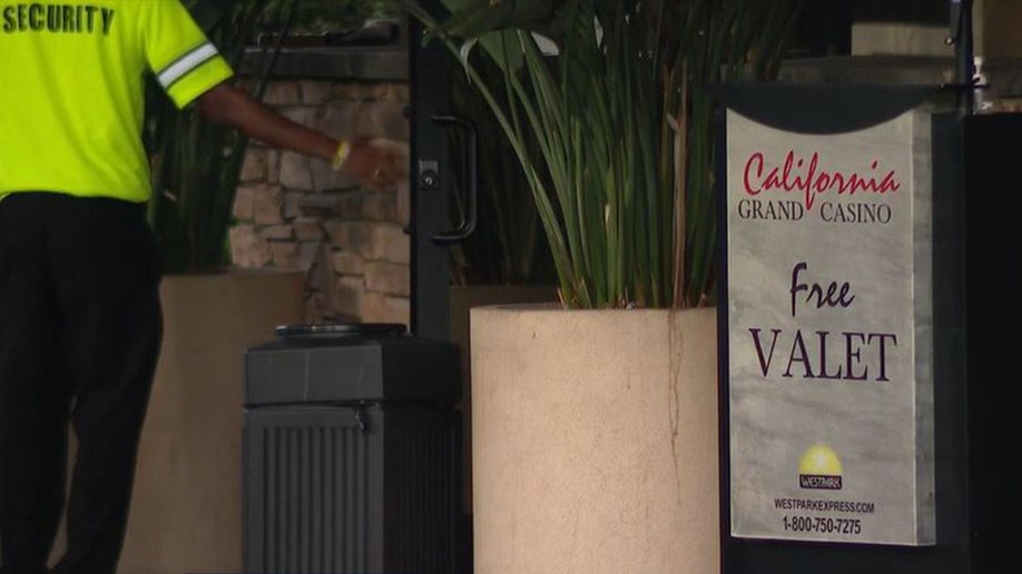 Security guard outside doors of California Grand Casino