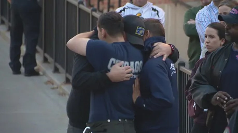 Chicago FD firefighters embrace