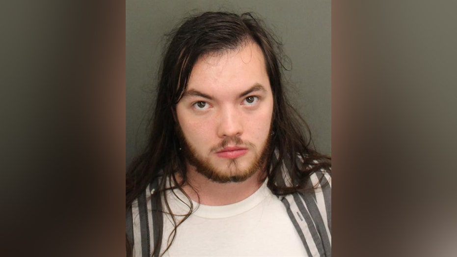 Man arrested for allegedly recording boy over bathroom stall at Florida resort: police