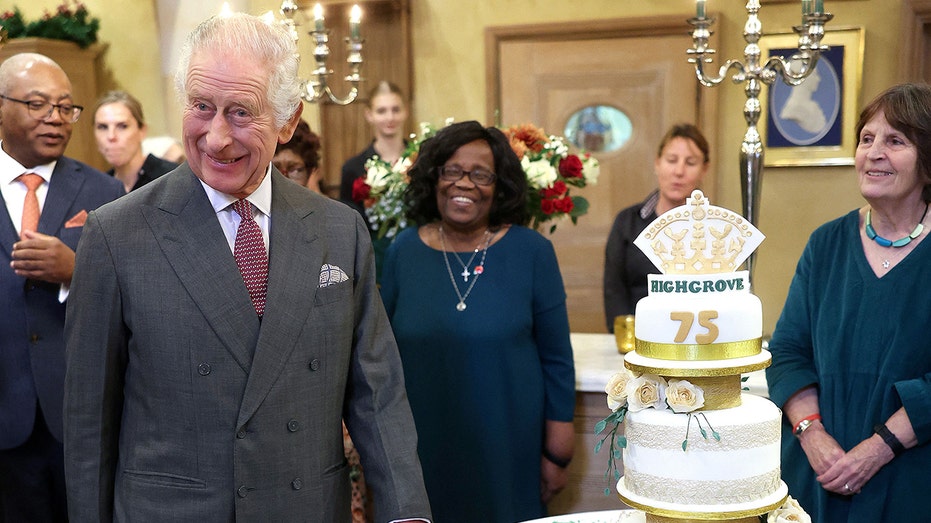 King Charles surprised with three-tiered cake at early birthday party: ‘We need to give you doggie bags’