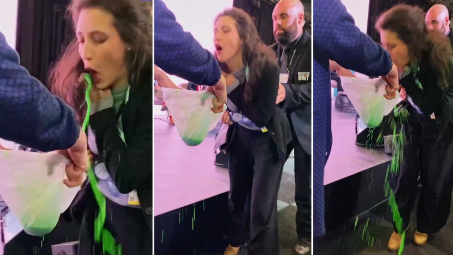 Climate activist disrupts ritzy EU conference with messy green goo vomit demonstration