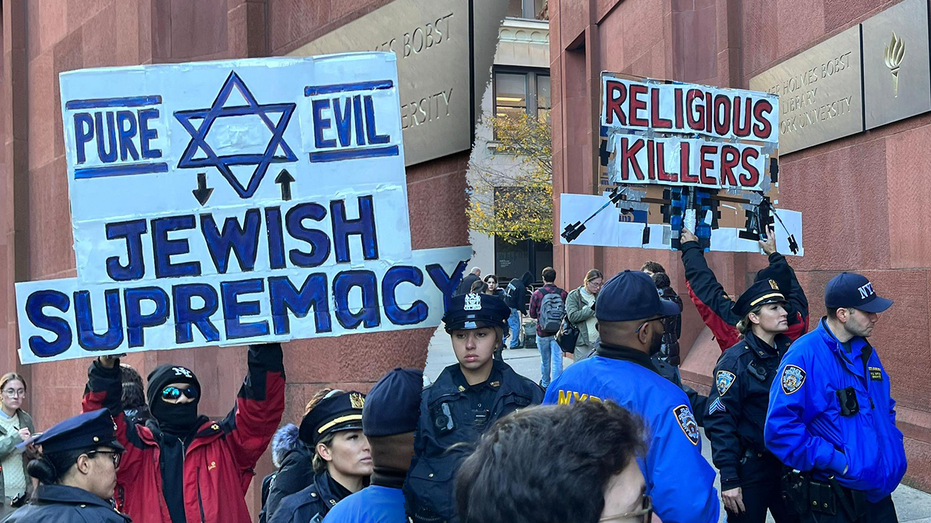 Protester at NYU pro-Palestinian rally spits on 'Jewish' sign, equates with 'White Supremacy'