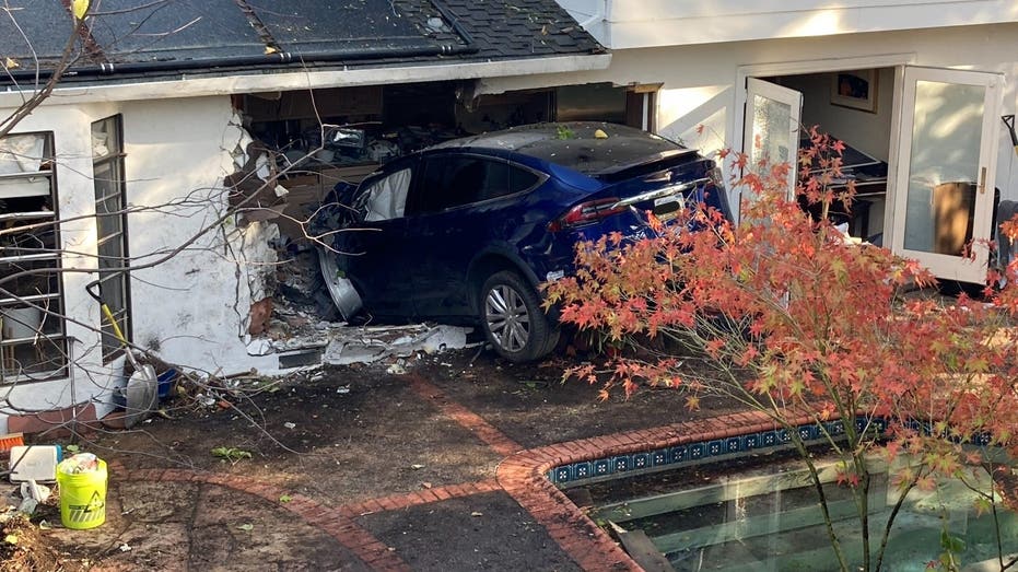 California Tesla driver flies over pool, crashes through house and stops in kitchen, police say