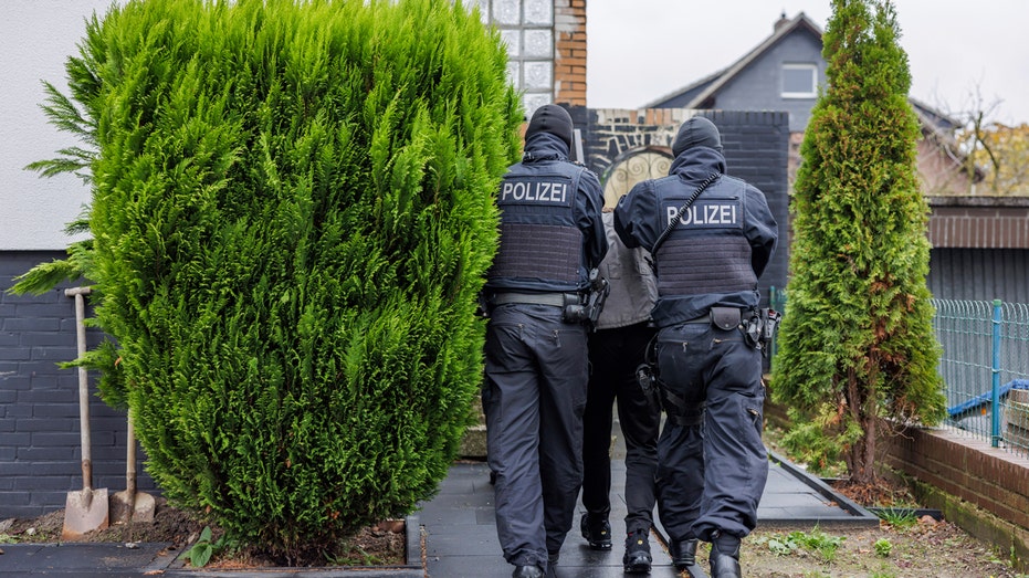 German police arrest 2 men accused of smuggling over 200 migrants into Europe