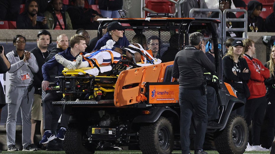 Virginia running back undergoes spinal surgery after leaving game on stretcher