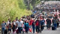 Migrants take part in a caravan towards the border with the United States in Tapachula, Chiapas State, Mexico, on December 24, 2023. Mexican President Andres Manuel Lopez Obrador on December 22 said that his government would step up efforts to contain irregular migration flows. Lopez Obrador said the "extraordinary" migration situation would be the focus of talks with Secretary of State Antony Blinken and other senior US officials in Mexico City on Wednesday.