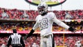 Dec 25, 2023; Kansas City, Missouri, USA; Las Vegas Raiders cornerback Jack Jones (18) interacts with then crowd during the second half against the Kansas City Chiefs at GEHA Field at Arrowhead Stadium.