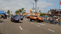 Drivers in low rider cars perform stunts for the crowd at 2022 San Diego Pride Parade on July 16, 2022 in San Diego, California. (Photo by Daniel Knighton/Getty Images)