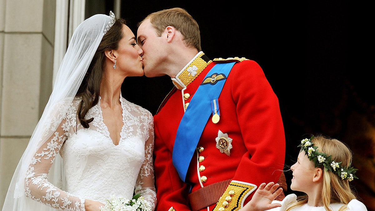 Kate Middleton and Prince William kissing on their wedding day